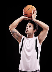 Image showing Basketball, shooting and man in studio with fitness, training or game target practice on black background. Sports, exercise or male player with handball for body workout, performance or aim challenge