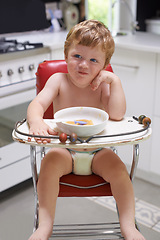 Image showing Eating, toddler and baby in chair for food, feeding or meal in house kitchen or home for breakfast. Hungry kid, wellness and healthy boy child with bowl for nutrition, natural diet or growth alone