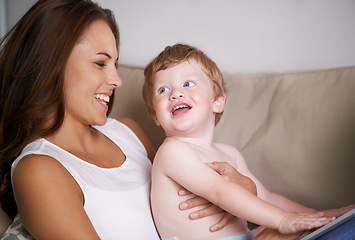 Image showing Happy sofa or mom with toddler in home for care, love or smile together to nurture child development. Relax, laugh or single parent mother with baby, boy or kid for support or trust in family house