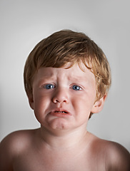 Image showing Sad toddler, anxiety and portrait of baby in his home with emotional problem or loss in childhood. Crying, trouble and house with a frustrated young male kid, infant or boy with tears, fear or crisis