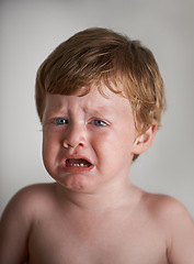 Image showing Sad toddler, crying and portrait of boy in his home with emotional anger or loss in childhood. Moody, trouble and house with a frustrated young male kid, infant or baby with tears, fear or noise