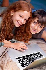Image showing Children, relax and portrait with laptop on floor together with happiness and online games for holiday or vacation. Kids, smile and playing with computer on website, streaming or search on internet