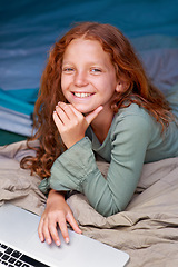 Image showing Child, relax and portrait with laptop in bed with happiness to play online games for holiday or vacation. Kid, smile and scroll on computer website, streaming movie or elearning with internet