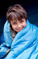 Image showing Travel, camping and portrait of child in sleeping bag for resting, relax and comfortable in tent gear. Happy, youth and boy in sleep sack for adventure on holiday, vacation and weekend outdoors