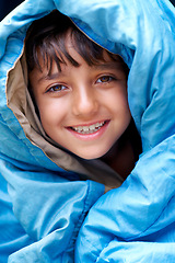 Image showing Boy, child and tent portrait for camping, relax and happy summer vacation in outdoor travel. Young camper, smile and wrapped in sleeping bag, adventure or nature with recreation for childhood
