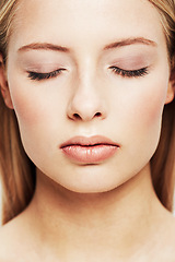 Image showing Woman, face and closeup of skincare, beauty or makeup cosmetics for dermatology or cosmetology. Young female person with closed eyes for facial treatment, spa or salon for foundation or skin glow