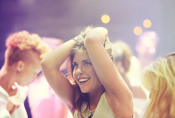 Image showing Night, club and happy woman at party to dance with energy to techno, music festival and rave at concert event. Girl, smile and celebration at nightclub with confidence, pride and freedom in movement