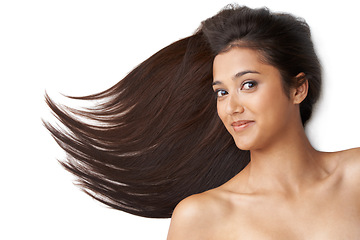Image showing Hair care, woman and portrait or wind in studio with keratin treatment, soft texture and shampoo or collagen shine . Model, face and beauty with hairstyle, cosmetics and happy on white background