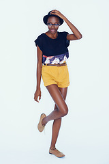 Image showing Fashion, happy and African woman on a white background in trendy, stylish and casual clothes. Confidence, hipster style and isolated attractive person with smile, accessory and happiness in studio