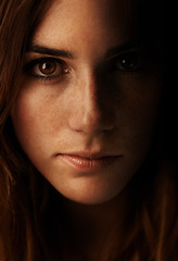 Image showing Woman, beauty and portrait with shadow and freckles in studio in the dark. Natural, makeup and female person face from Ireland with cosmetics treatment, confidence and serious with black background