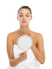 Image showing Face, check and woman with mirror in studio for anti aging, treatment or skincare results on white background. Face, hands and female model with reflection inspection, beauty or after shower routine
