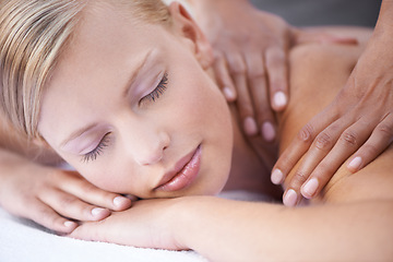 Image showing Young woman, hands and massage for back in spa, health and wellness on bed for physical therapy. Person, reflexology and masseuse for body treatment by touch and muscle comfort with peace at resort