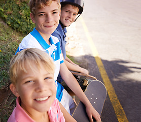 Image showing Friends, sports and skaters in outdoor portrait, children and confidence for street style. Happy siblings, brotherhood and relaxing on road adventure, bonding and love or hobby on vacation or holiday