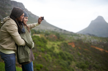 Image showing Couple, hiking selfie and mountains for travel, journey and adventure with photography and mock up space. Happy people with love, hug and profile picture for trekking in winter and nature tourism