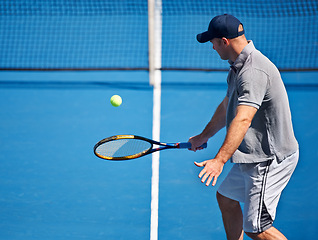 Image showing Athlete, man and tennis on court with serve, competition and performance outdoor with fitness and energy. Sport, player and ball on turf for training, exercise and racket with skill, game and hobby
