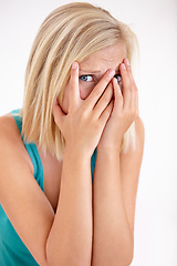 Image showing Terror, portrait and woman with hands on face, scared and confused with trauma in horror studio. Panic, scary danger and shocked embarrassed girl with stress, anxiety and fear on white background.