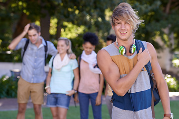 Image showing Young man, headphones and portrait on campus and scholarship opportunity for happy at college. Student, smile and casual person with audio electronics, backpack and university outdoor for learning