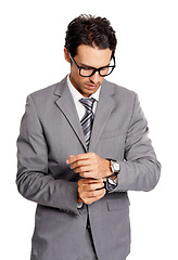 Image showing Formal, business and man adjust suit with fashion, style or watch on wrist in white background of studio. Serious, businessman and professional entrepreneur with care and pride in appearance in work