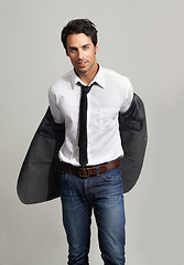 Image showing Fashion, confident and portrait of man in a studio with formal, elegant and classy outfit with blazer. Cool, handsome and young model from Canada with attractive style isolated by gray background.