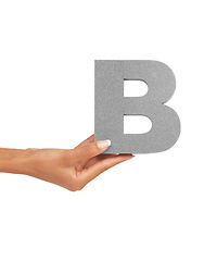 Image showing Hand of woman, capital letter B and presentation of consonant isolated on white background. Character, font and palm with English alphabet typeface for communication, reading and writing in studio.