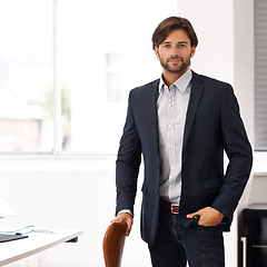 Image showing Portrait, office and businessman at startup with confidence, casual fashion and small business. Creative professional, art director and entrepreneur at desk with pride, project management and smile.