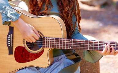 Image showing Nature, camp and closeup of girl with guitar for entertainment, talent or music in woods or forest. Playing, musician and child with acoustic string instrument outdoor in park on weekend trip.