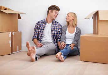 Image showing Couple, moving and new home with boxes for packing, real estate and happy holding hands for support. Property, achievement or investment with people and cardboard for relocation, mortgage or rent