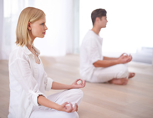 Image showing Lotus hands, meditation and couple on a floor for peace, balance and spirituality in their home together. Relax, profile and people in a living room for zen, stress relief or holistic self care