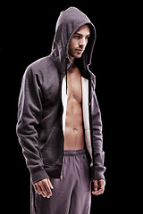 Image showing Fashion, body and fitness man in studio with hoodie, jacket or gym, clothes or style choice on black background. Exercise, chest or profile of confident male model with comfortable workout outfit