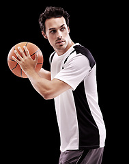 Image showing Basketball, fitness and man in studio with game, training or speed, resilience or practice on black background. Sports, exercise or player with ball for body workout, action and performance challenge