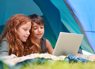 Image showing Children, family and happy with laptop in tent for camping, social media and online movie with watching in nature. Friends, face and kids with smile outdoor on grass for gaming, relax and holiday fun