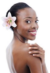 Image showing Black woman, skin and flower in portrait, beauty and wellness with dermatology and nature on white background. Orchid, eco friendly cosmetics and body care with natural and clean skincare in studio