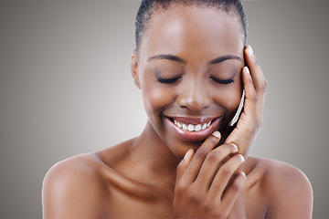 Image showing Cosmetics, beauty and face of black woman on mockup with smile, natural makeup or facial in studio. Skincare, dermatology and happy girl on grey background space for skin glow, shine and wellness.