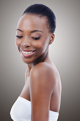 Image showing Skincare, dermatology and face of black woman in studio with smile, natural makeup or facial glow. Cosmetics, relax or beauty of happy girl on grey background for healthy skin care, shine or wellness