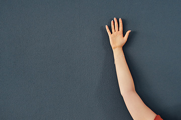 Image showing Hand, raise and question asking for education on grey wall background or training, learning or mockup space. Person, fingers and answer response with information or vote agreement, opinion or meeting