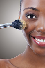 Image showing Brush, makeup and black woman, portrait and beauty with foundation for cosmetics, wellness and cropped on grey background. Shine, cosmetology and tools to apply powder, glow and shimmer in studio