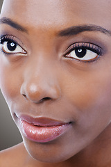 Image showing Makeup, beauty and face of black woman on gray background for wellness, cosmetics and skincare. Dermatology, salon aesthetic and closeup of person with eyeshadow, lipstick and glamour in studio