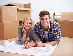 Image showing Man, woman and portrait with floor plan of new home for renovation or moving boxes, apartment or relocation. Couple, face and ground with coffee or blueprints for house, development or improvement