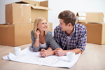 Image showing Man, woman and happy with floor plan blueprints for home renovation or moving boxes, apartment or investing. Couple, ground and paper for house development for improvement, buying or new beginning