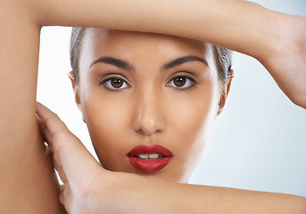 Image showing Beauty, confident and portrait of woman in studio with cosmetic and face routine with red lipstick. Self care, makeup and female model with facial cosmetology treatment for glow by gray background.
