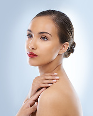 Image showing Beauty, makeup and woman in studio with red lipstick for skincare, cosmetic and face routine. Self care, confident and female model with facial cosmetology treatment for glow by blue background.