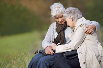 Image showing Senior women, friends and embrace in nature, bonding and grief in outdoor environment. Elderly people, garden and comfort in peaceful park for affection, sadness and hugging for care in retirement