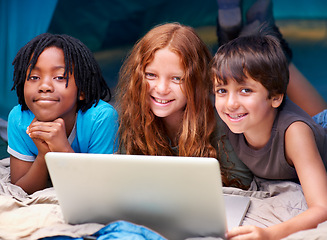 Image showing Children, laptop and relax in tent portrait together with happiness and online games for holiday or vacation. Kids, smile and playing with computer on website, streaming or search on internet