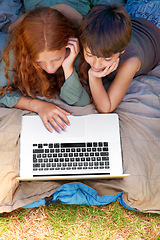 Image showing Children, internet and search with laptop in tent for camping, social media or movie with aerial view in nature. Family, online and siblings or browsing outdoor on grass for trip, relax and holiday