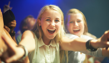 Image showing Friends, happy or selfie at concert in portrait, bonding or excited for social fun at music festival. Women, together or smile on face at live show, event or celebration in crowd at disco performance