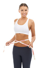 Image showing Woman, lose weight and happy with results on measuring tape in studio or white background. Fitness, check and person reading measurement and size of body for health, wellness and progress in goals