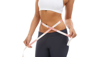 Image showing Woman, lose weight and hands with measuring tape closeup in studio or white background. Fitness, check and person reading measurement and size of body for health, wellness and progress in goals