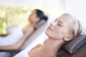 Image showing Spa, woman and wellness on massage bed with relax for skincare, zen and beauty treatment for body care. Person, sleeping and physical therapy at resort, salon table and luxury on holiday or vacation