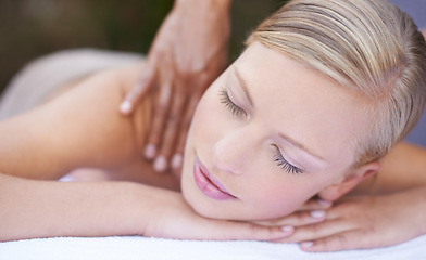 Image showing Woman, massage and masseuse to relax, neck and spa for treatment and stress relief therapy. Sleeping, therapist and wellness in resort, peaceful and hands for luxury bodycare and tranquility