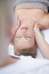 Image showing Young woman, relax and massage in spa for health, wellness and peace with hands for shoulder pain. Person, comfort or release of muscle tension by masseuse, body treatment or detox in resort for zen